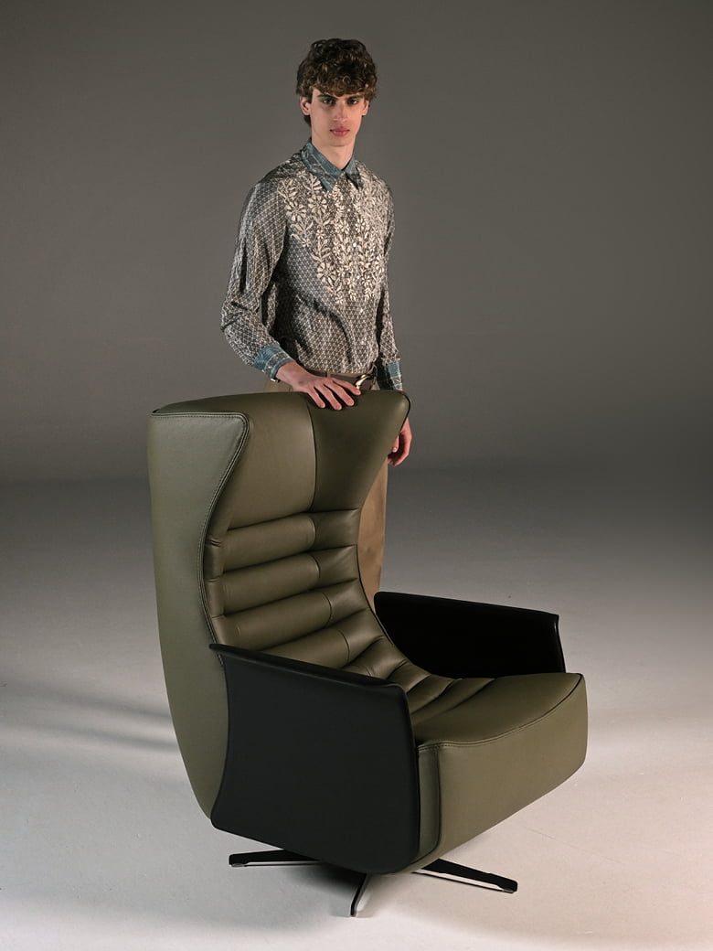 GERRIT The 'Gerrit' armchair is a comfortable, modern classic with quilting detail that extends to a matching footstool. Optional swivel base and customizable finishes cater to personal or office use.