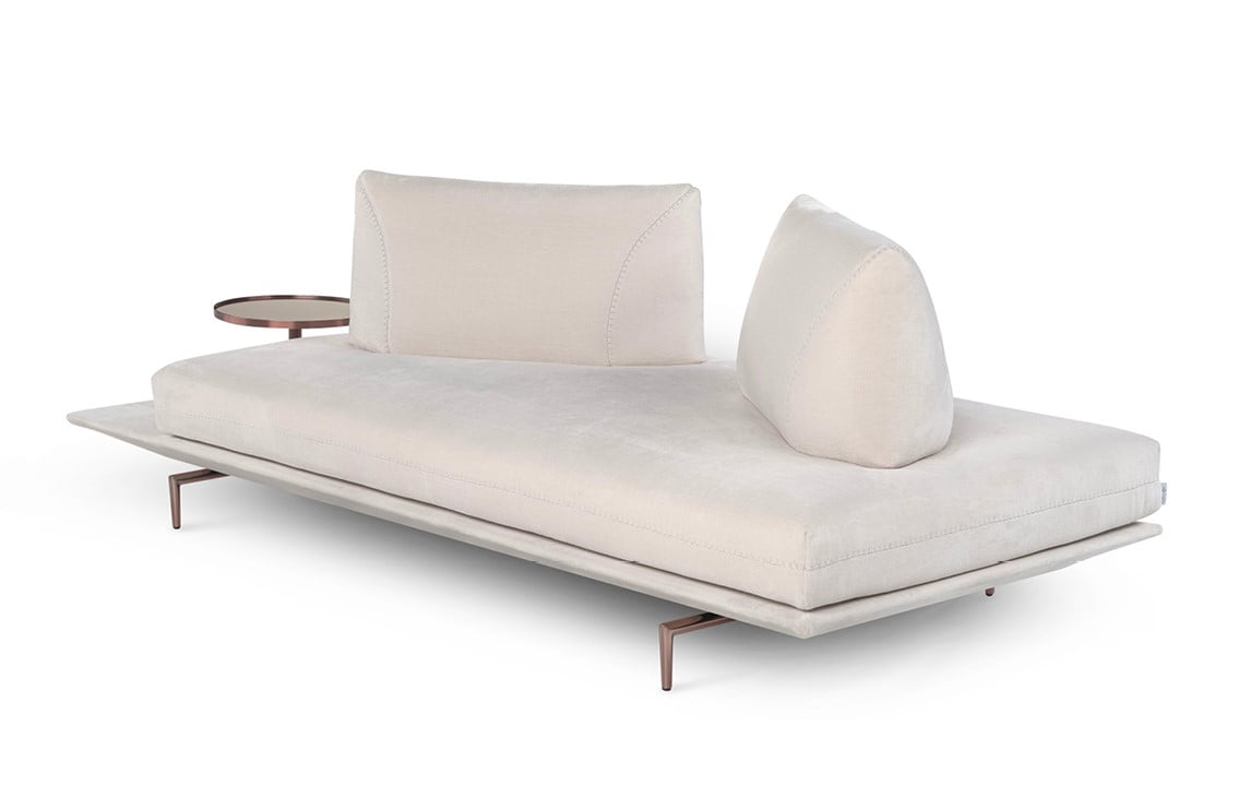 GIANDUIOTTO A versatile sofa offering adjustable backrests for multiple seating positions, elegant design stitching, and optional integrated table surfaces, elevated by stylish metal feet.