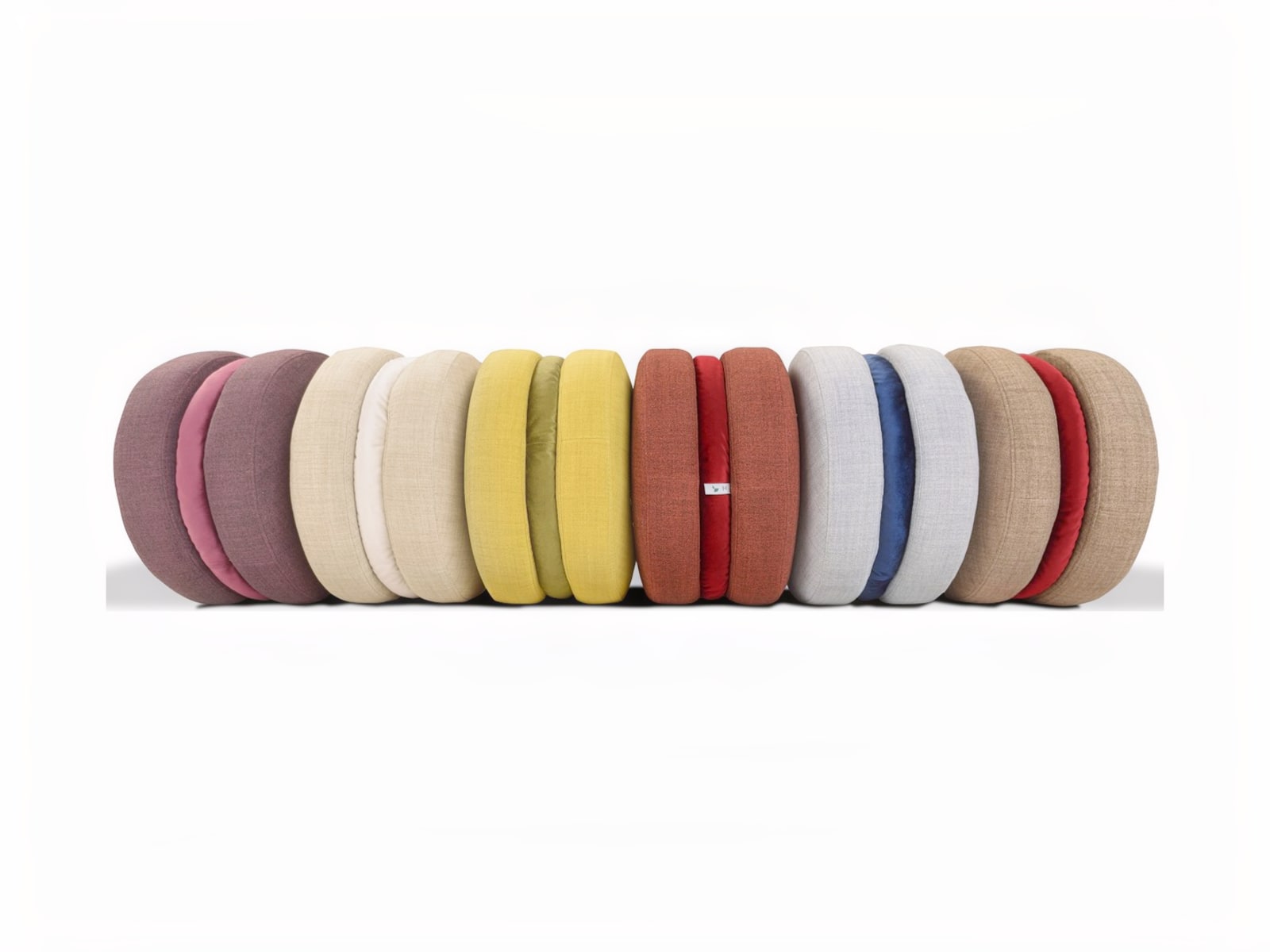 MACARONS Trapezio footstools offer unique, versatile design, suitable for any room, with soft comfort and choice of fabric or leather finishes. Ideal for both aesthetic and functional needs.