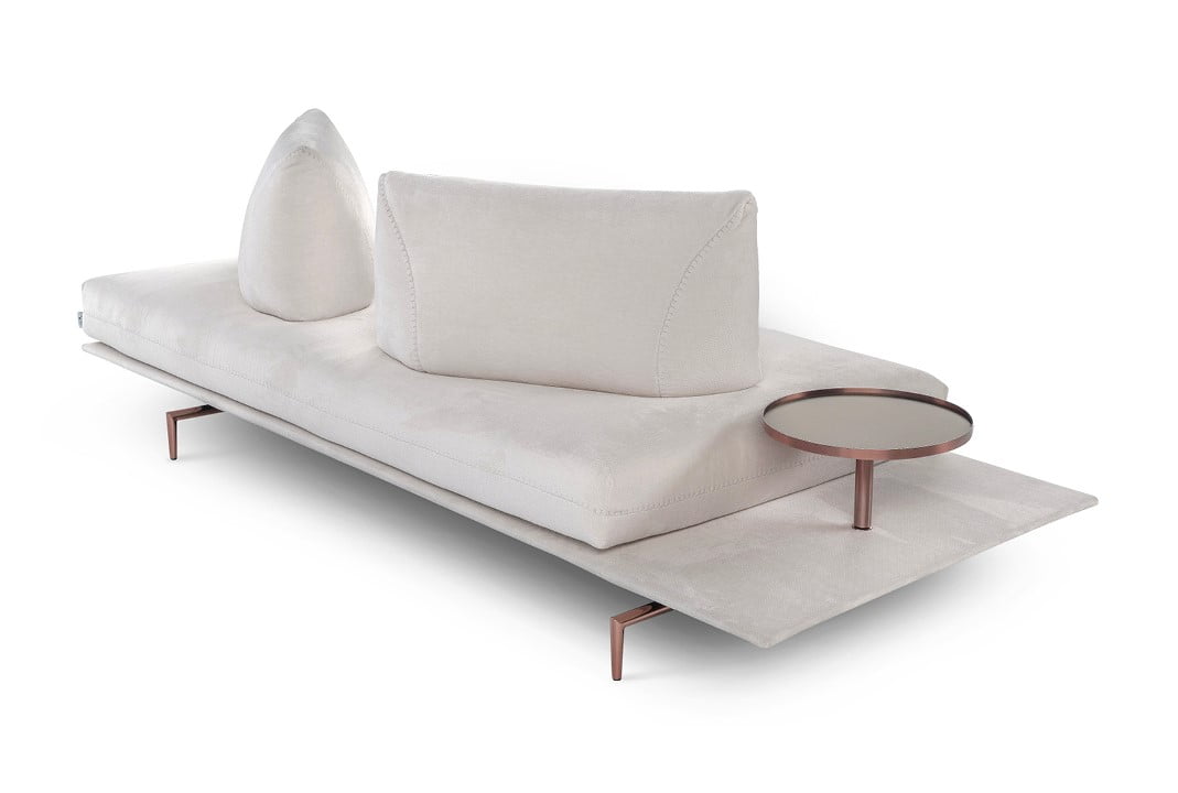GIANDUIOTTO A versatile sofa offering adjustable backrests for multiple seating positions, elegant design stitching, and optional integrated table surfaces, elevated by stylish metal feet.