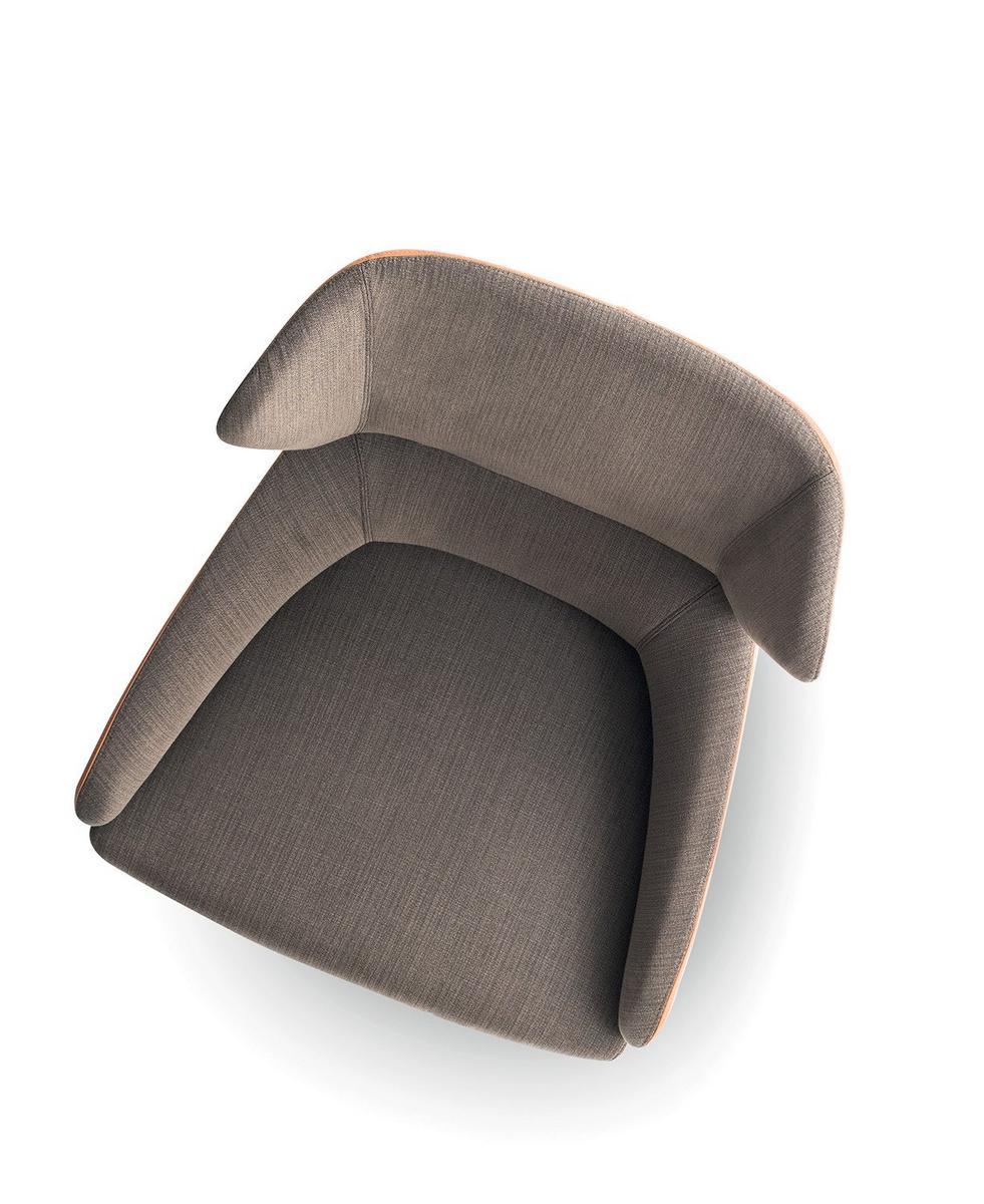 CUT Wing fabric armchair with 4-spoke base