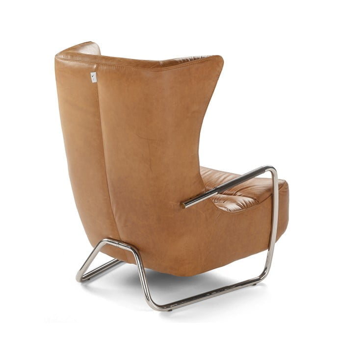 GERRIT The 'Gerrit' armchair is a comfortable, modern classic with quilting detail that extends to a matching footstool. Optional swivel base and customizable finishes cater to personal or office use.
