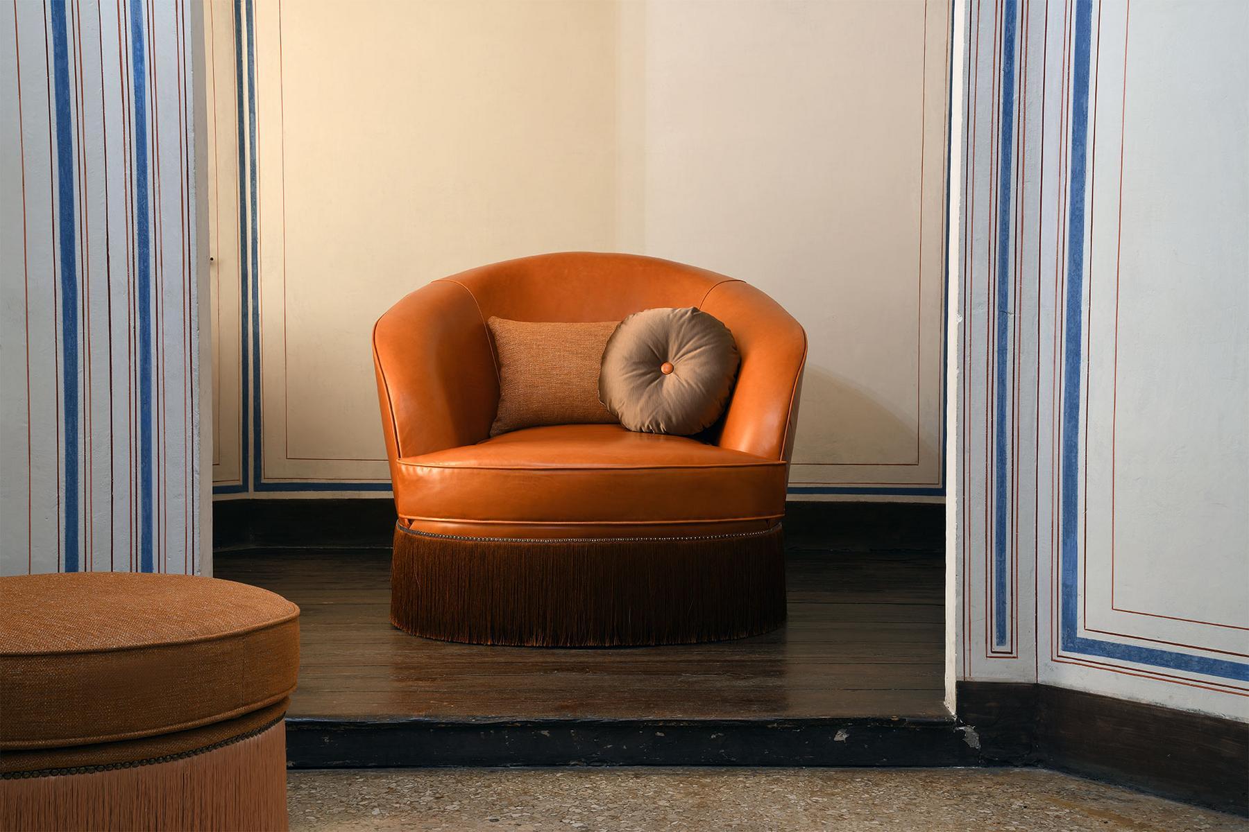 DIONE Upholstered leather armchair with armrests