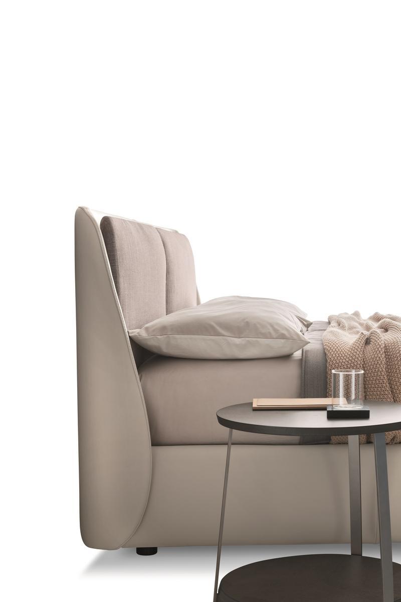 BEND Leather bed with upholstered headboard