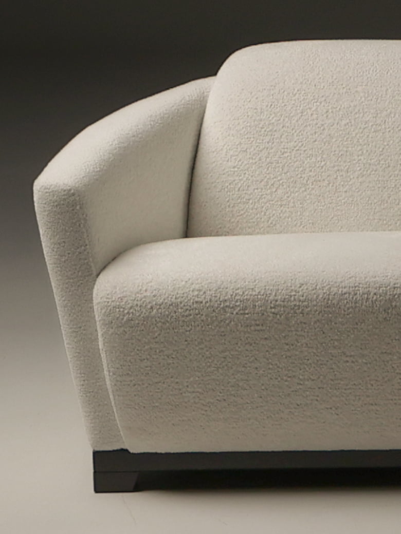 HOTEL Iconic 'Hotel' armchair with a timeless Art Deco design, renowned for comfort and versatility, available in leather or fabric, celebrated by decorators worldwide.