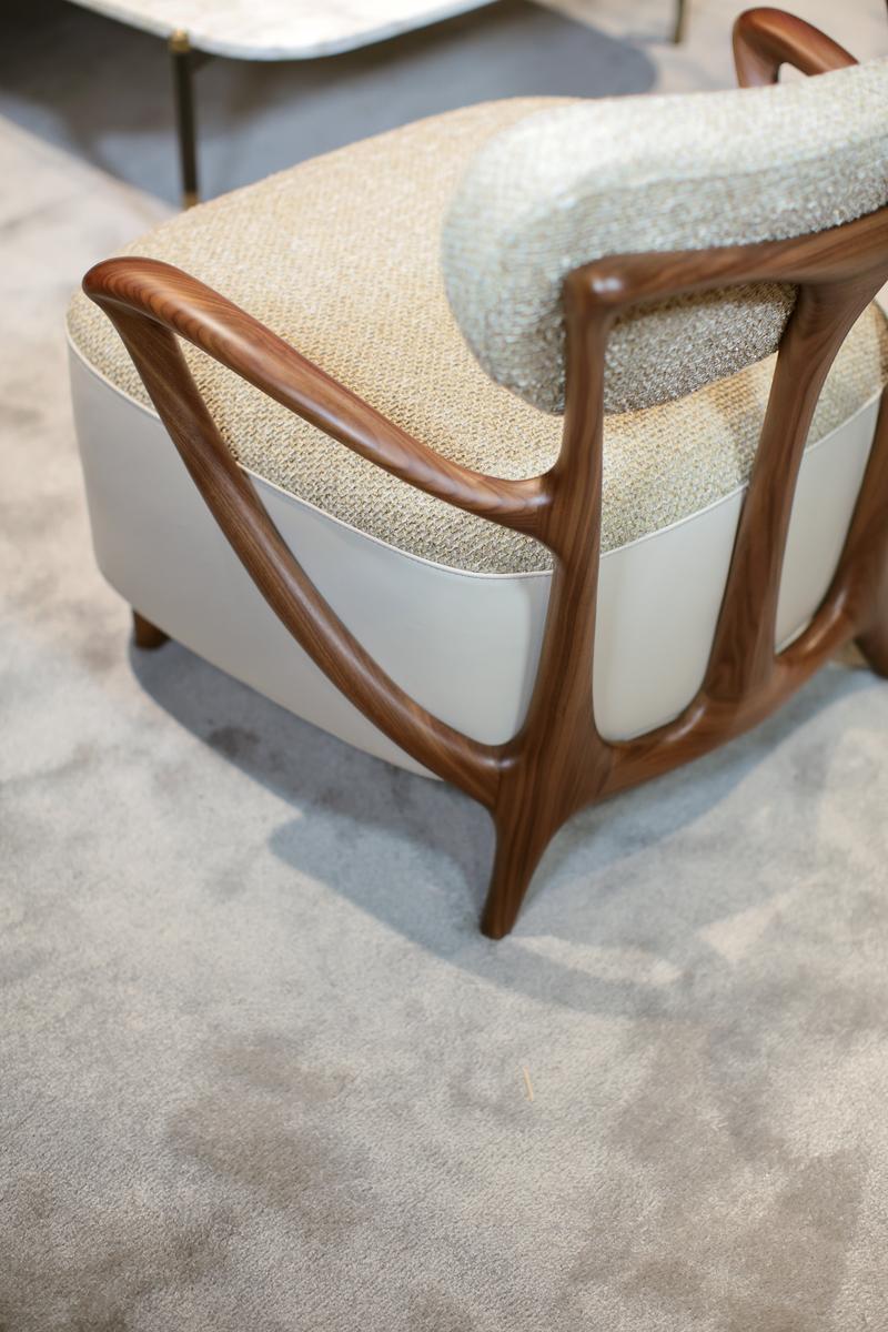 TEIA Upholstered fabric easy chair with armrests