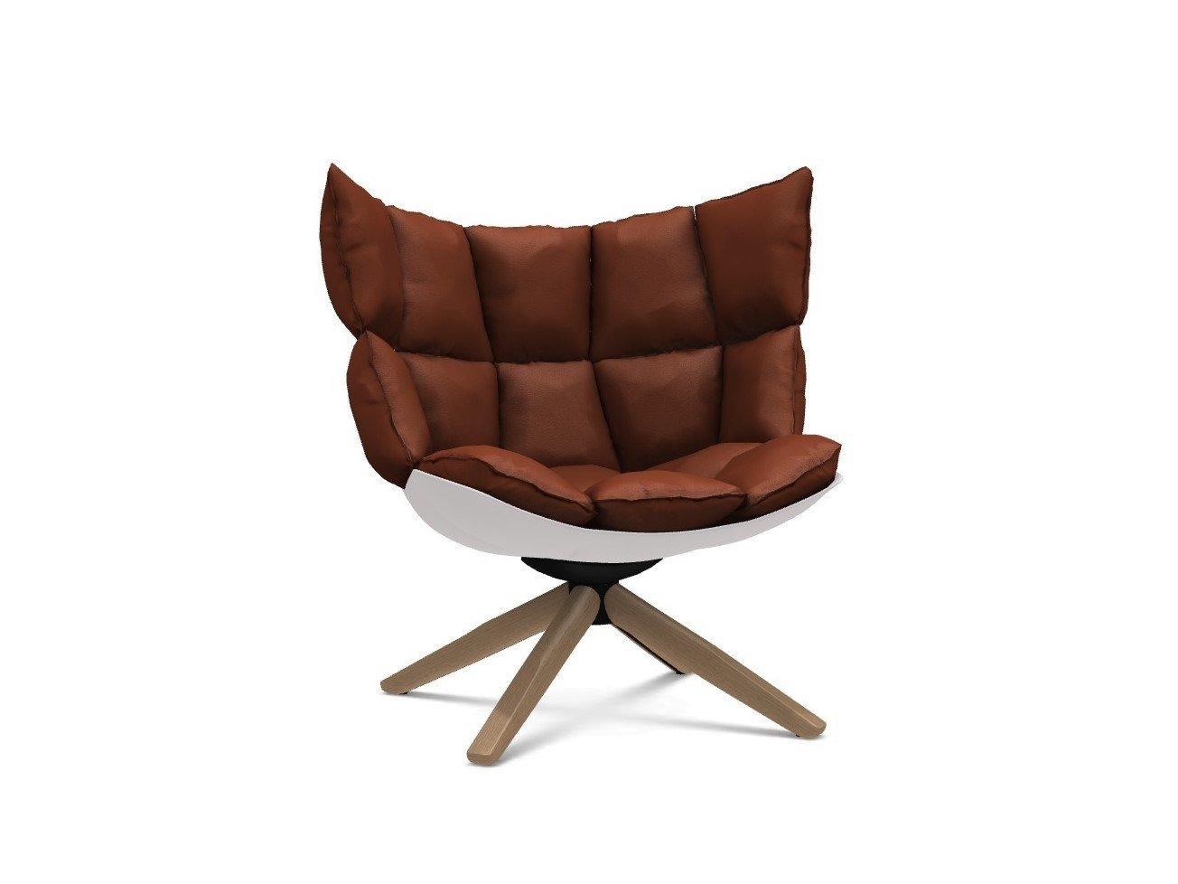 HUSK Upholstered trestle-based armchair
