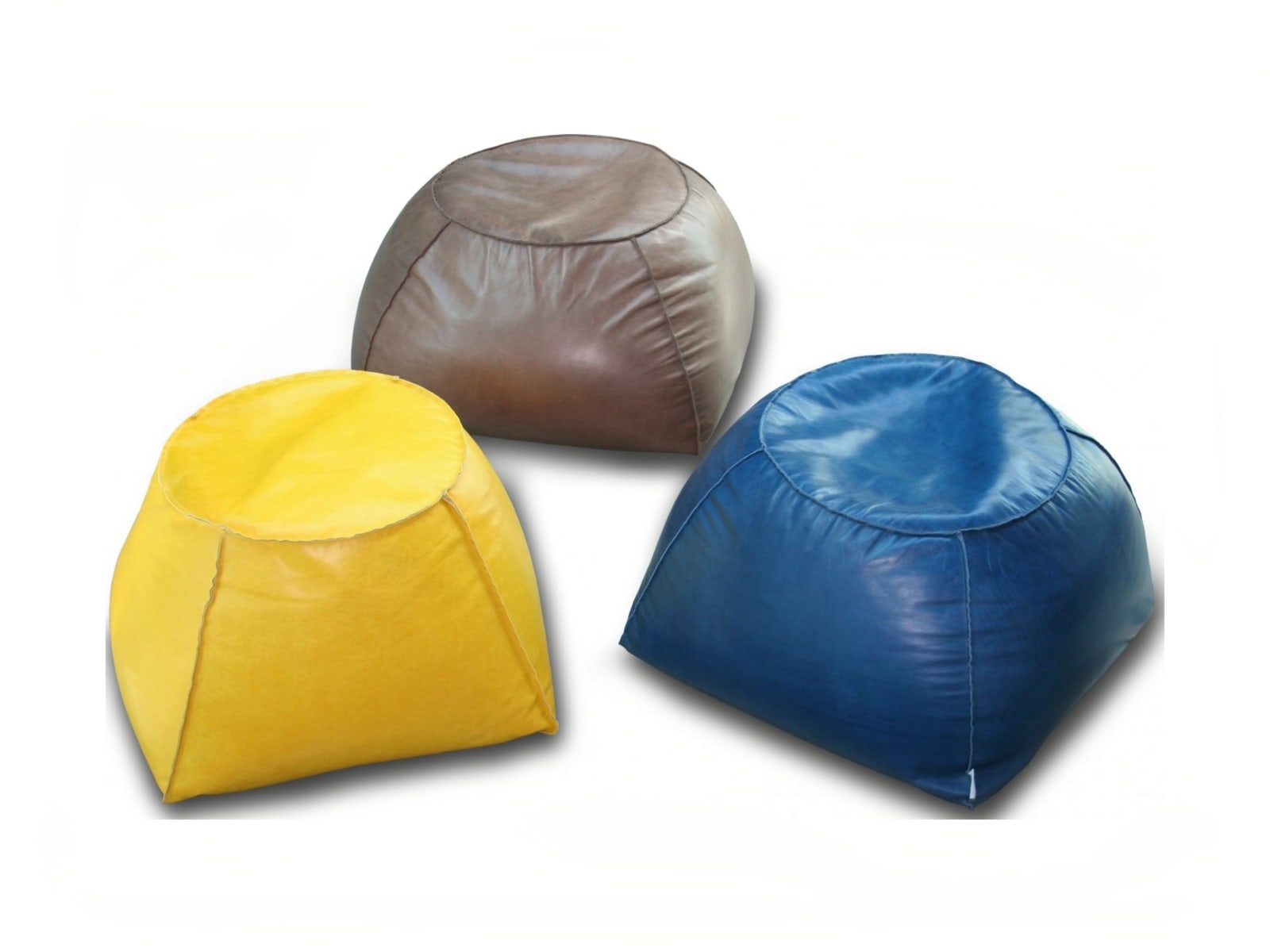 TRAPEZIO Trapezio footstool: unique-shaped, lightweight, versatile for any room, offers fabric or leather upholstery with a raw cut finish. Ideal for comfort and aesthetic appeal.