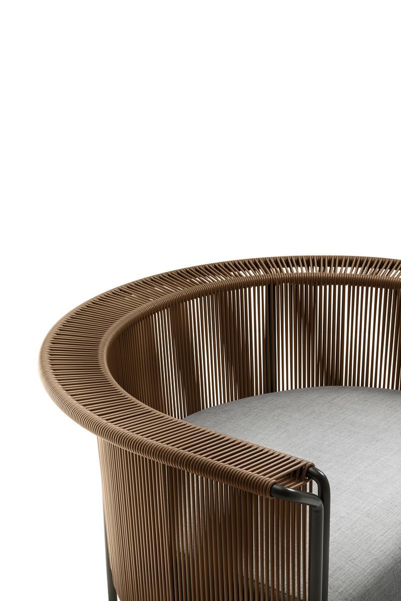 ALTON Tanned leather and fabric armchair with armrests