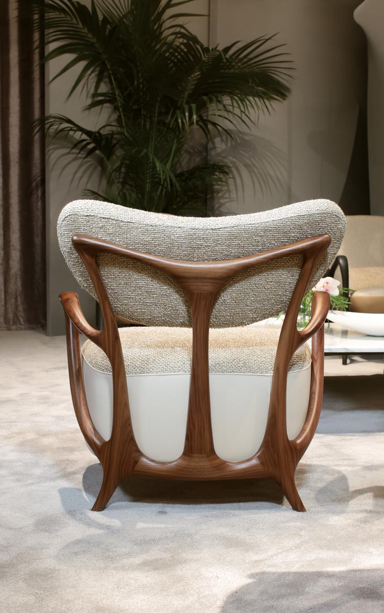 TEIA Upholstered fabric easy chair with armrests